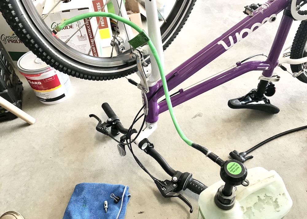 Slime tire sealant being applied to a woom bike