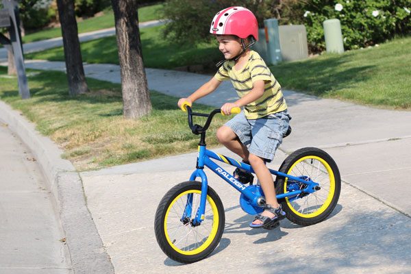 boy riding a blue MXR 16 inch bike
