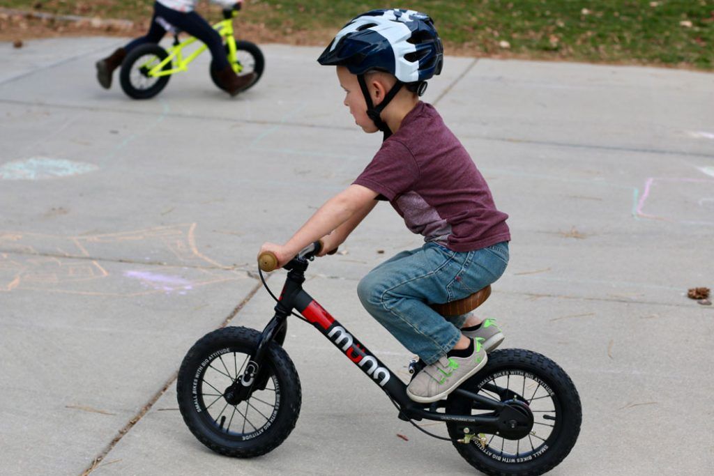 boy riding a muna balance bike review