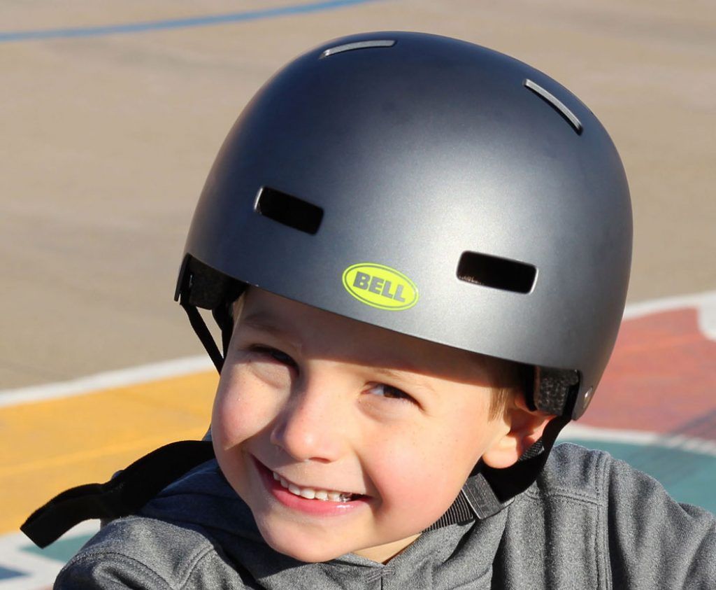 boy wearing a black bell span multisport helmet