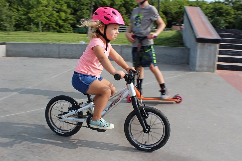 2 year old riding Prevelo Alpha One with focus at the skate park