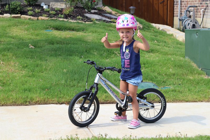 young girls riding the prevelo alpha one pedal bike