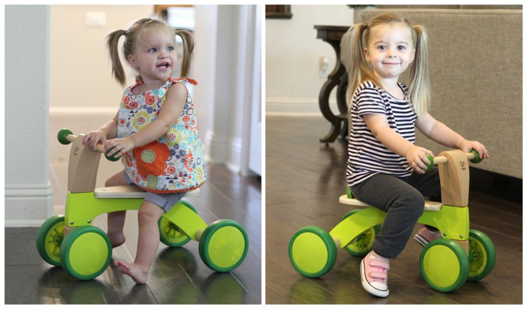 1 year old and 2 year old riding the hape scoot around