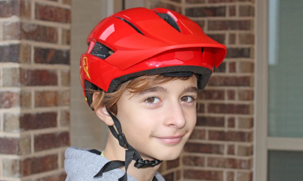 boy wearing a red sidetrack bike helmet
