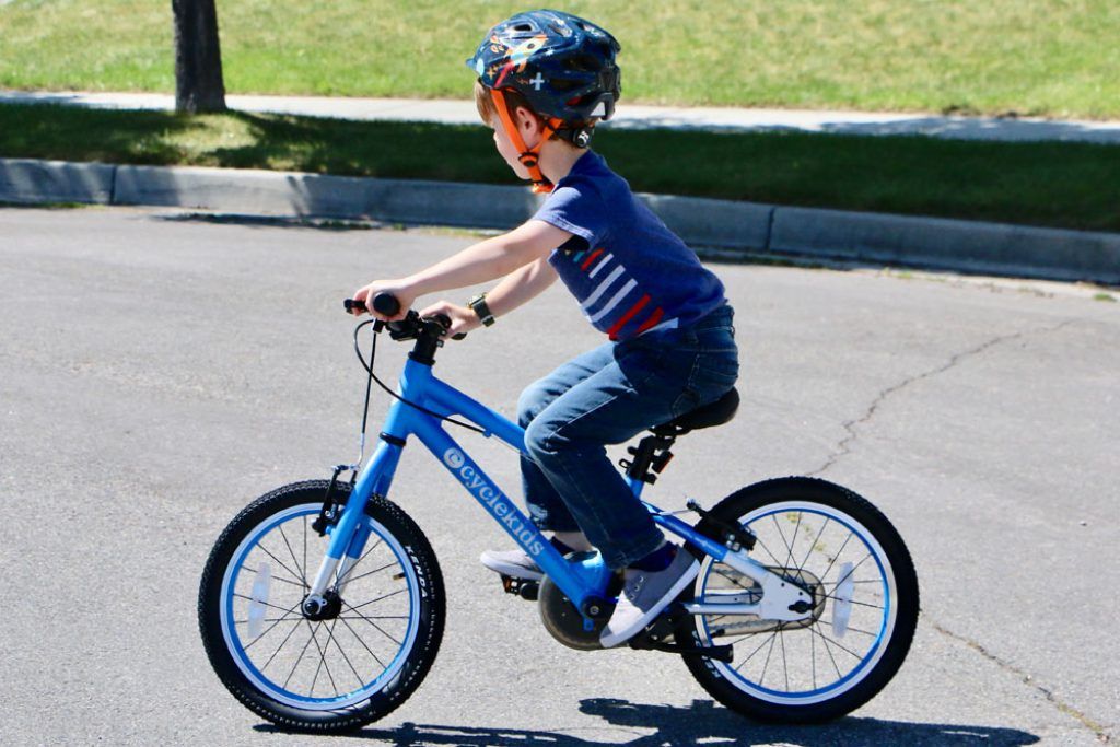 boy riding a blue cycle kids 16 inch bike