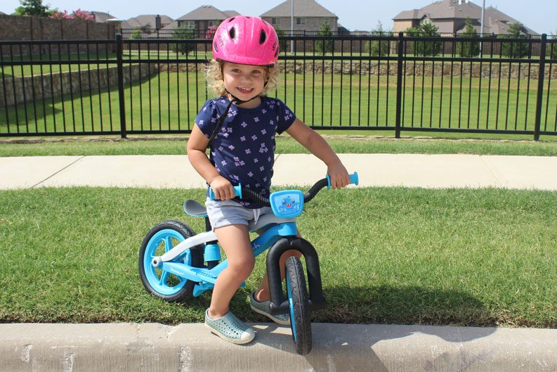 2 year old riding Chillafish BMXie balance bike and smiling