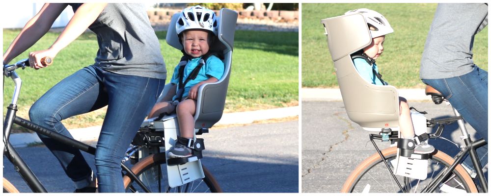 Child riding in BoBike Exclusive Tour child bike seat with high headrest that wrap around the head.