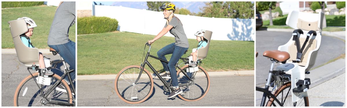 Mom riding Prioirty bicycle while carrying her son in the BoBike Exclusive Tour child bike seat.