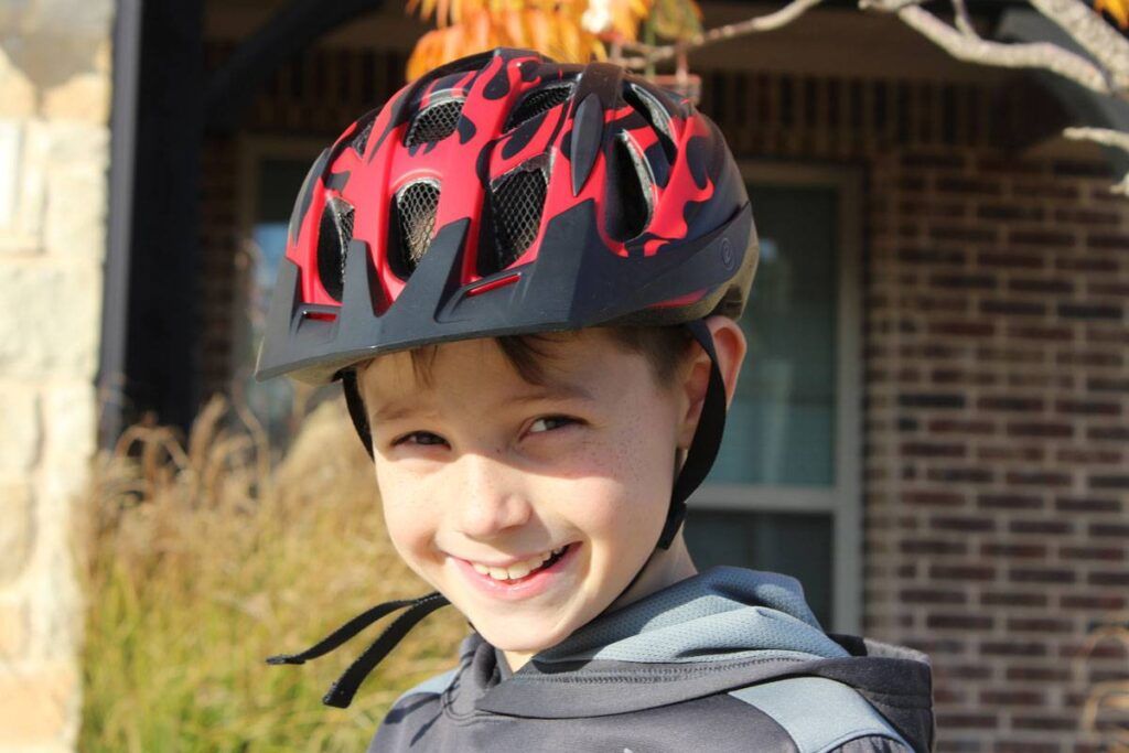 boy wearing red and blue lazer J1 helmet