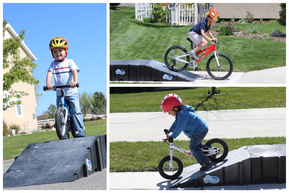 Kids riding on ramps on pedal bikes and balance bikes