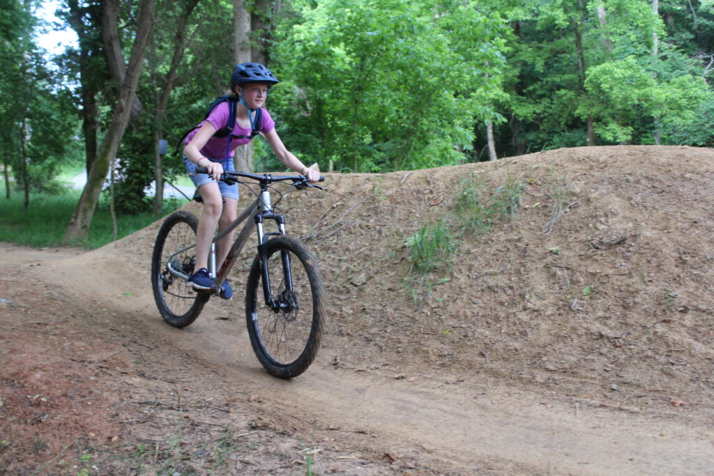 11 year old riding down trail at Slaughter Pen in Bentonville. Riding Marin Wildcat Trail 3 XS