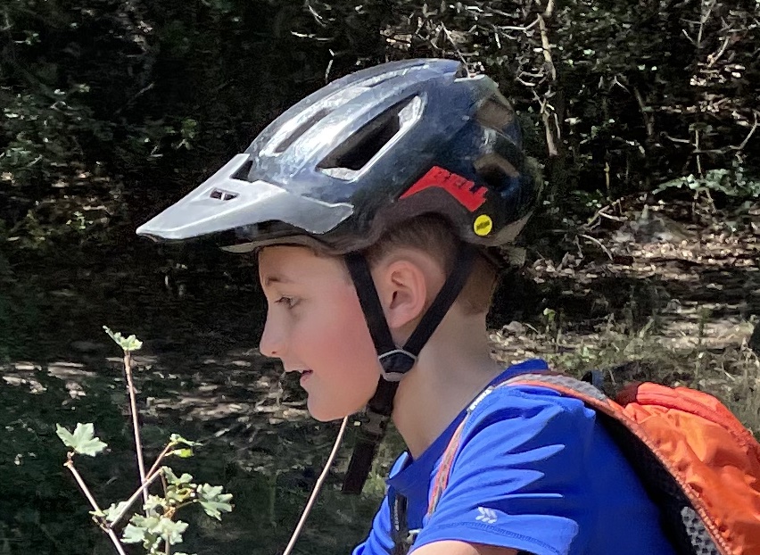 side shot of rider wearing the bell nomad jr helmet