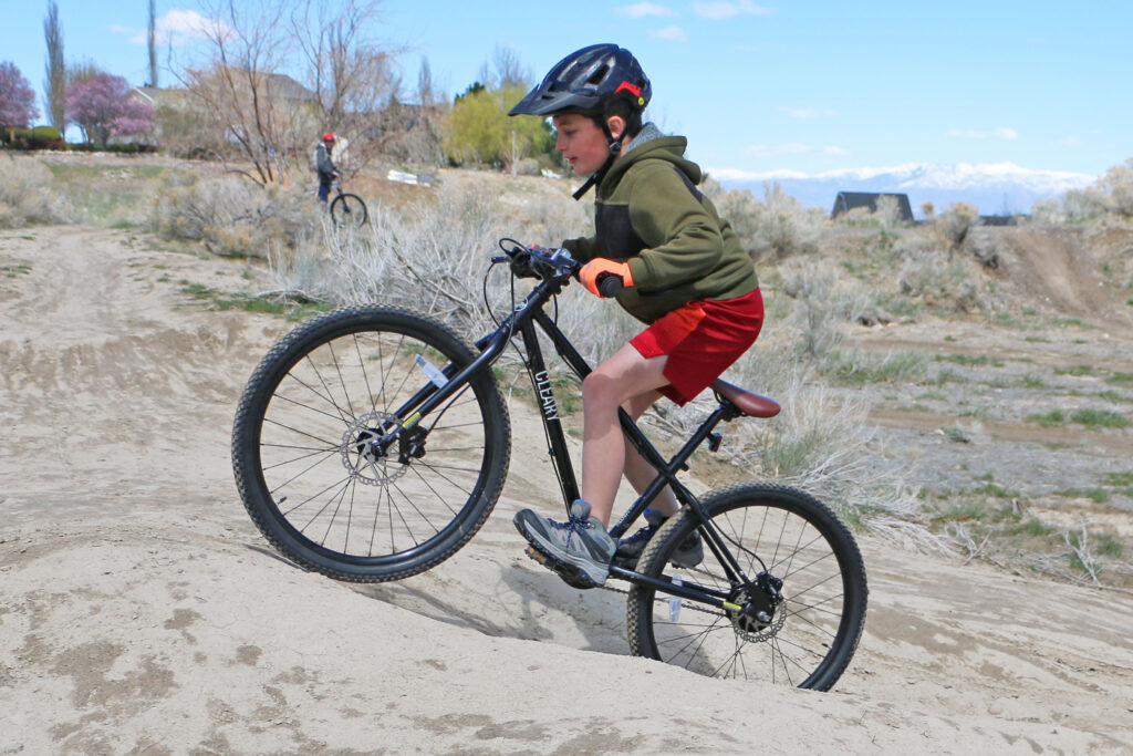9 year old boy riding the cleary meerkat 24 inch bike