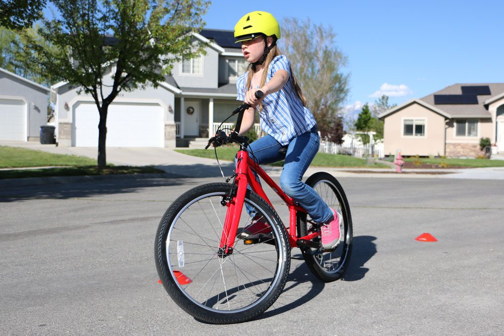 young girl riding the Specialized 24 inch Jett kids bike