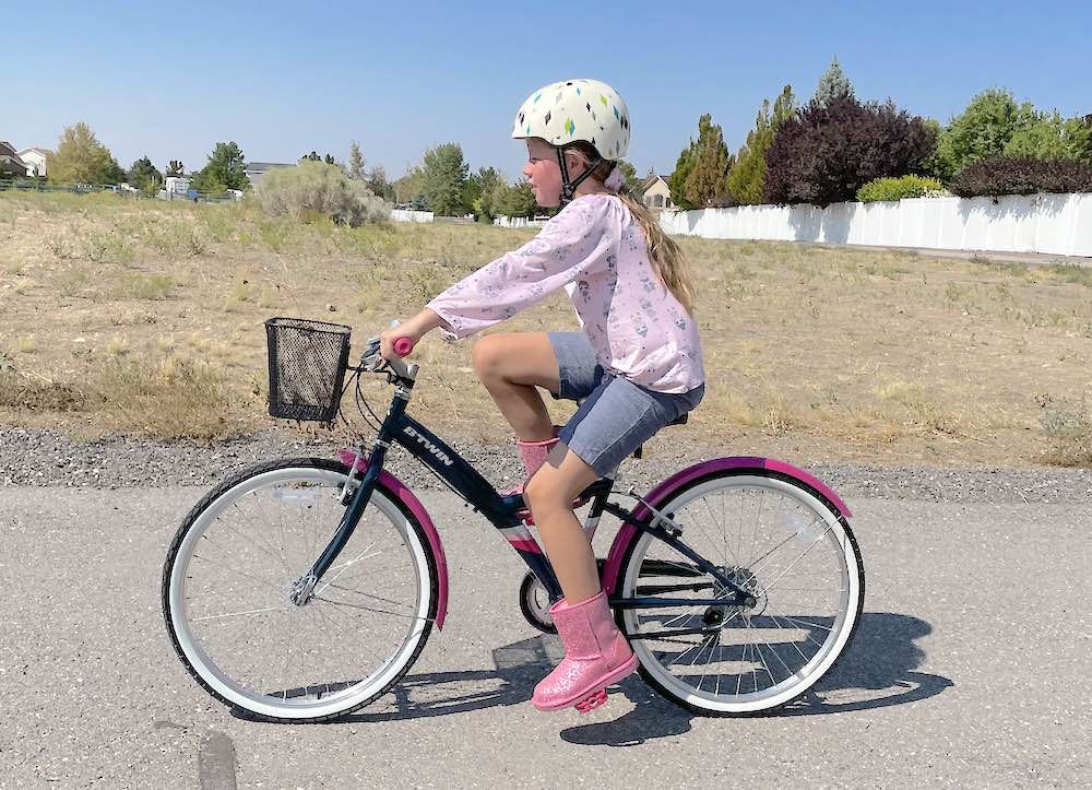young girl riding the Btwin Decathlon 24 Original bike