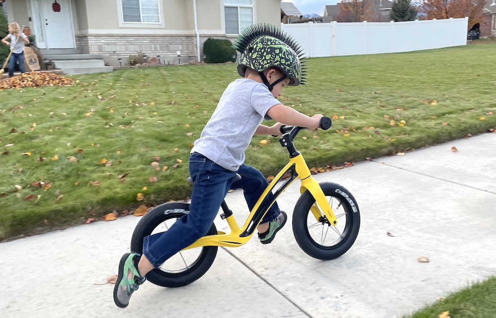 toddler testing out the Hornit AIRO balance bike