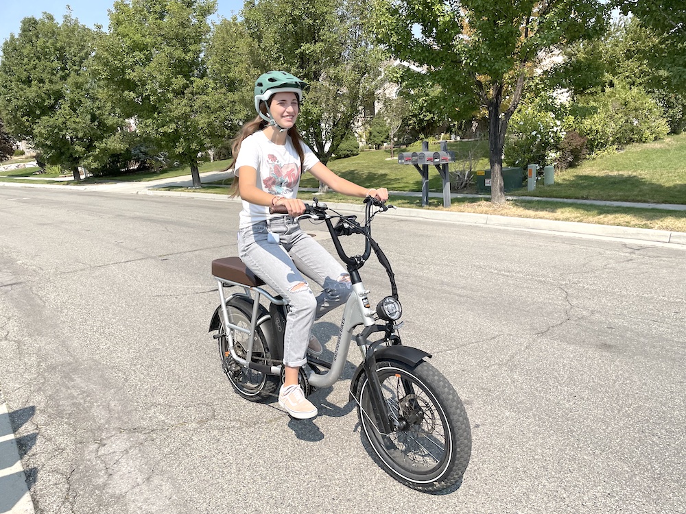 teenager riding an electric bike