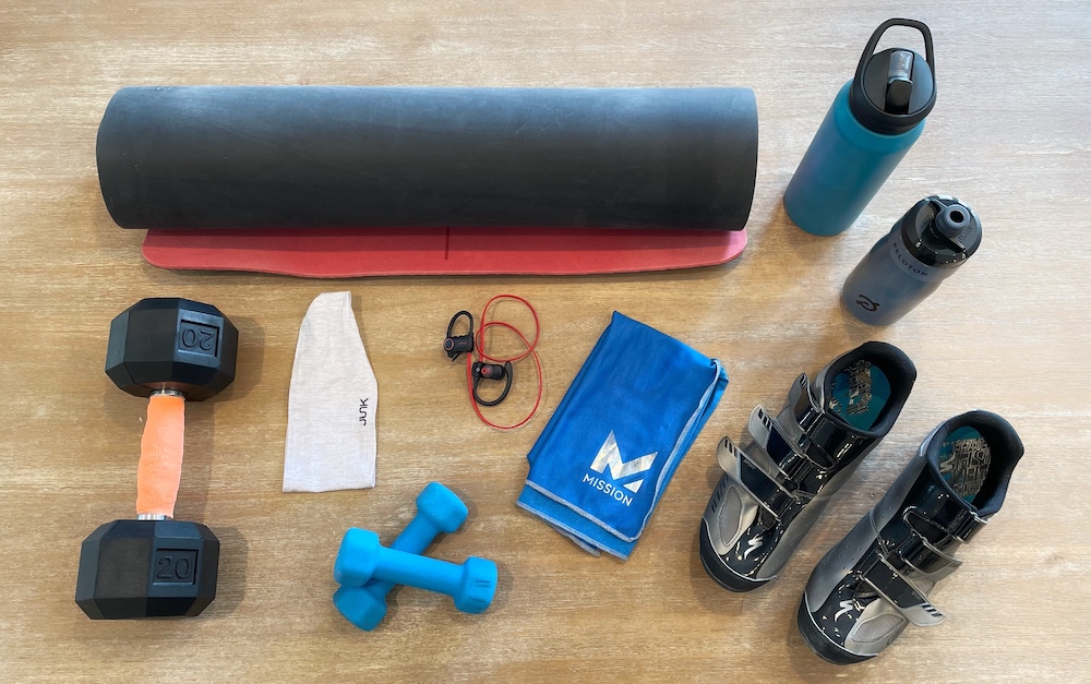 accessories for Peloton including water bottle, dumbbell, shoes and headphones