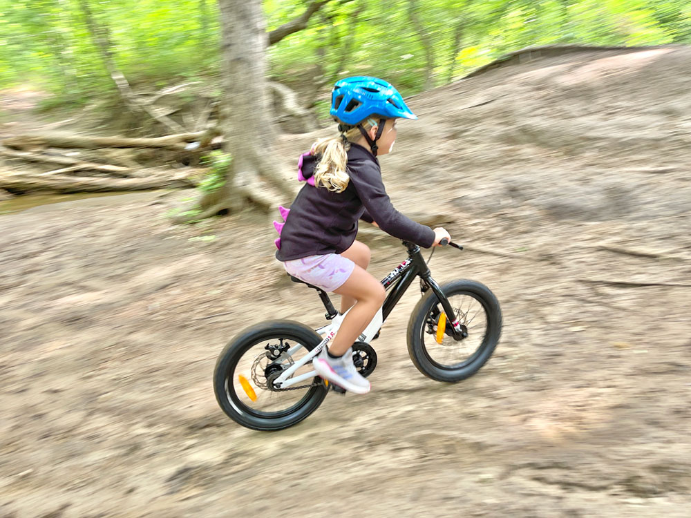4 year old riding Commencal Ramones 16 on dirt trail