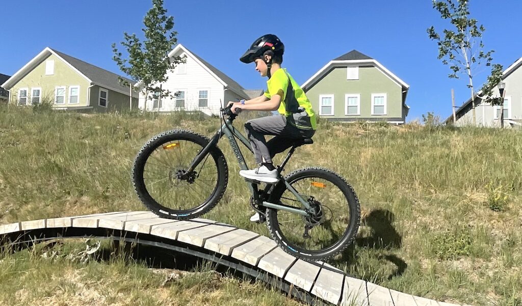 young rider on the Commencal Ramones 24 mountain bike on a bike ramp