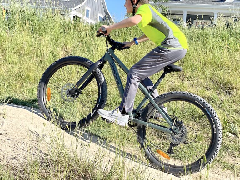 boy riding uphill on commencal Ramones 24 inch bike