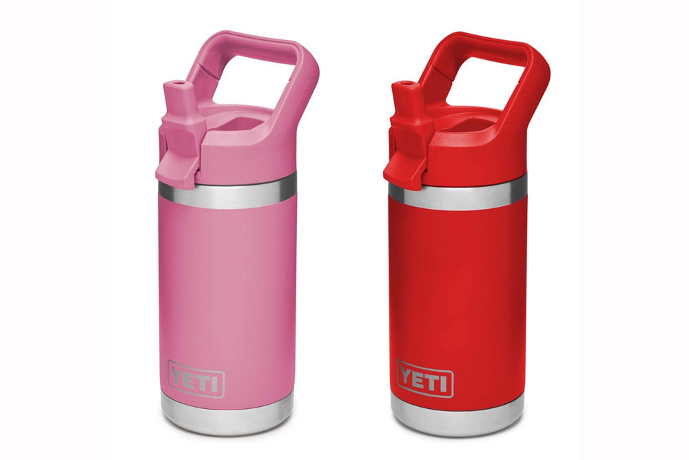 Two Yeti Rambler Jr. kids water bottles. Pink and red.