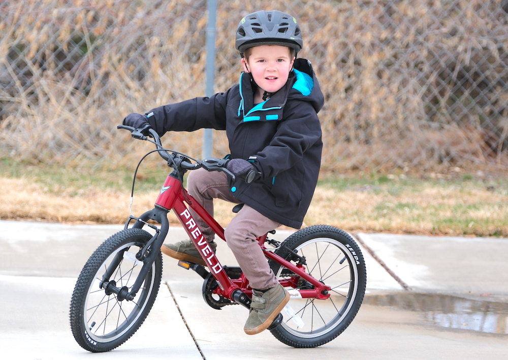 Young rider on a red prevelo alpha two bike