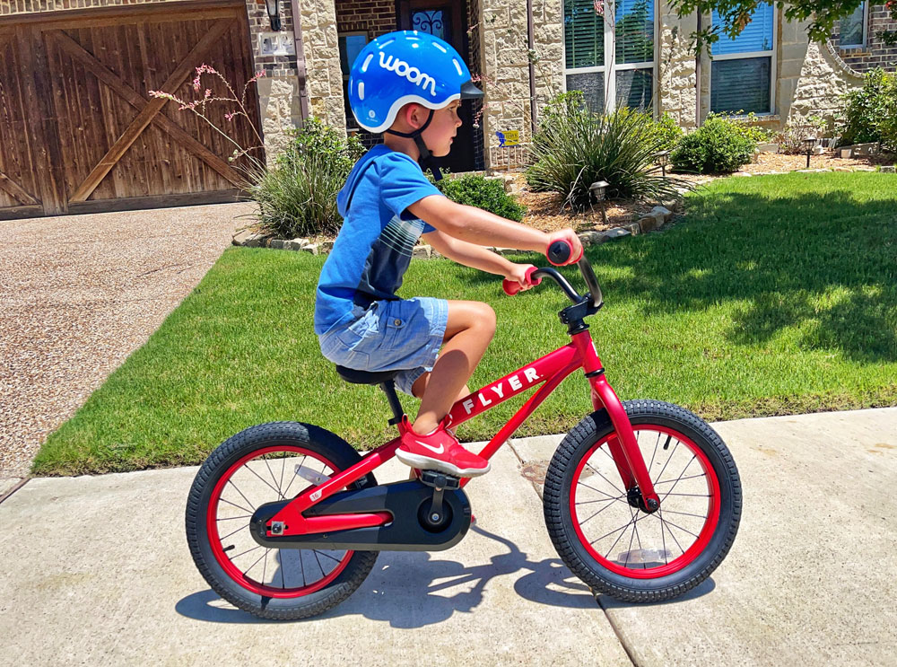 5 year old boy riding Radio Flyer FLYER 16 inch pedal bike
