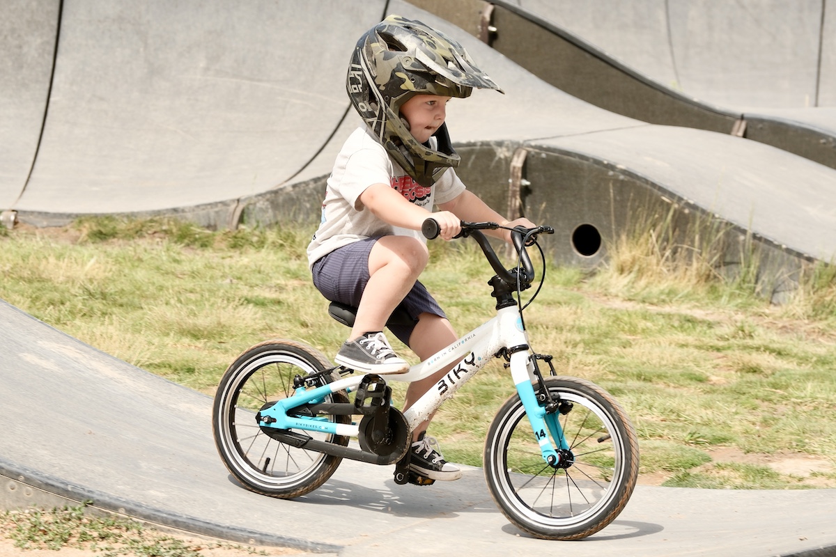 3 year old on biky bikes air 14 on a pump track