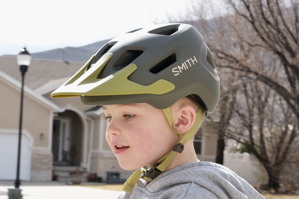 young child wearing a smith sidekick jr helmet