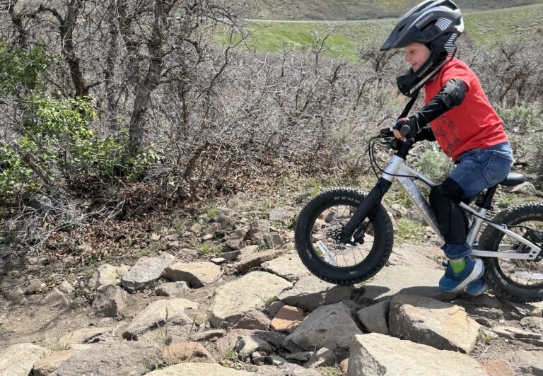 Prevelo Zulu One going down a rock garden in balance bike mode