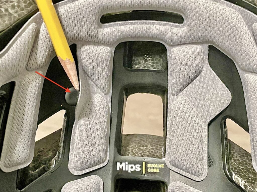 Pulling away pads to see MIPS anchor